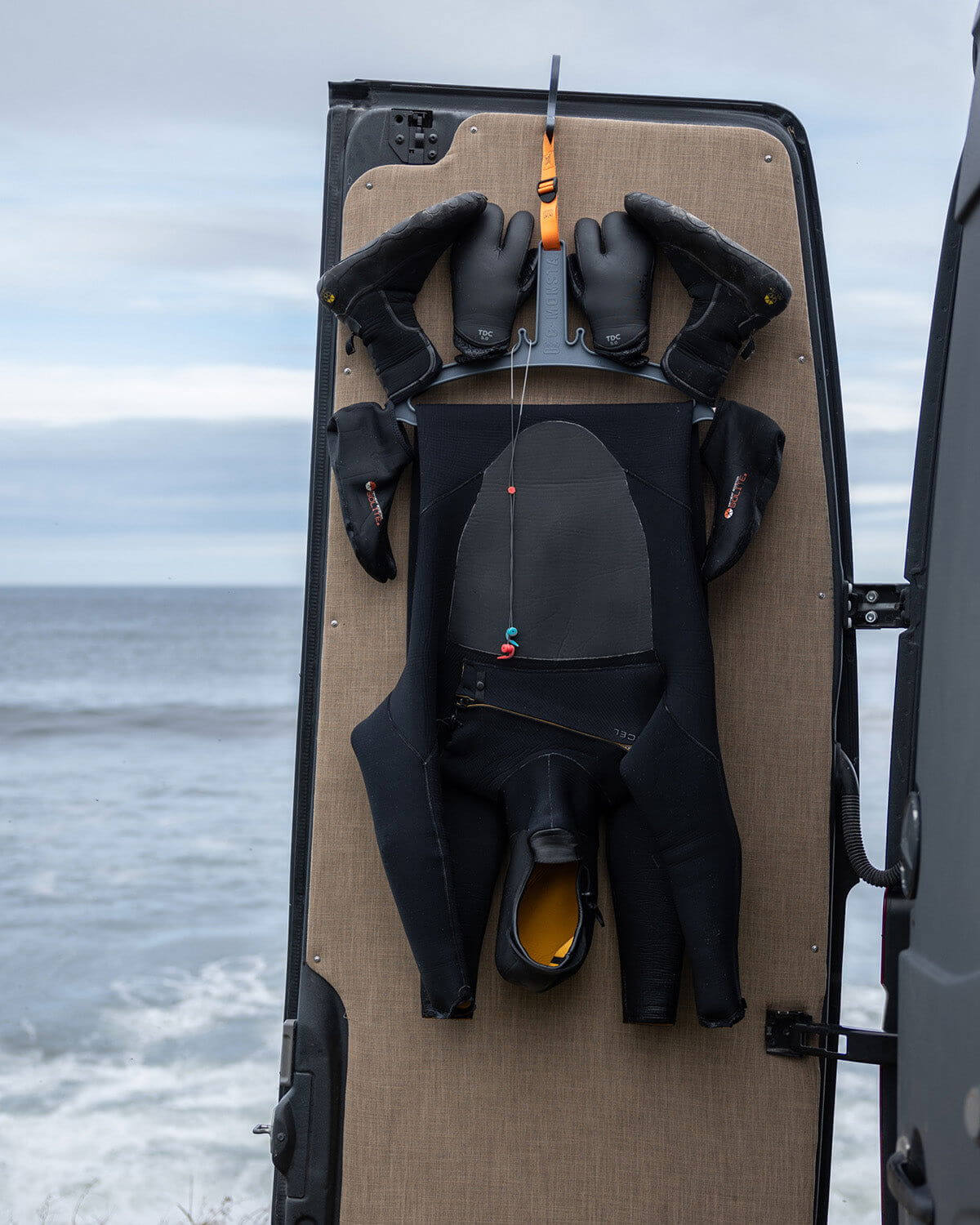 C-Monsta Wetsuit Hanger V2 (UK) displaying wetsuit, boots, and gloves for faster drying and organization.