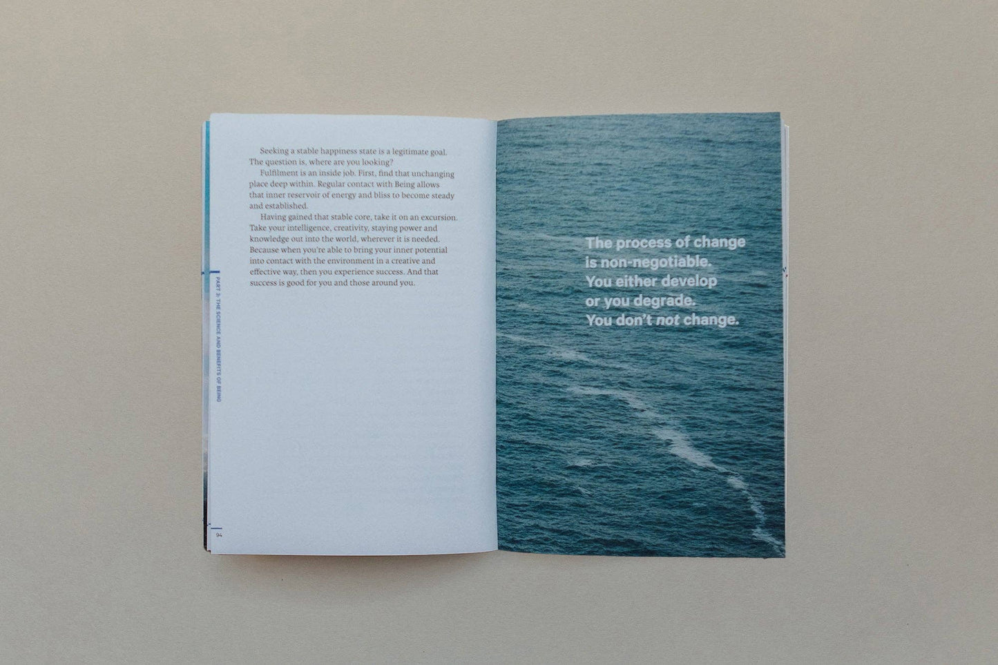 Interior pages of a book with text about change and an image of water, related to Vedic Meditation.