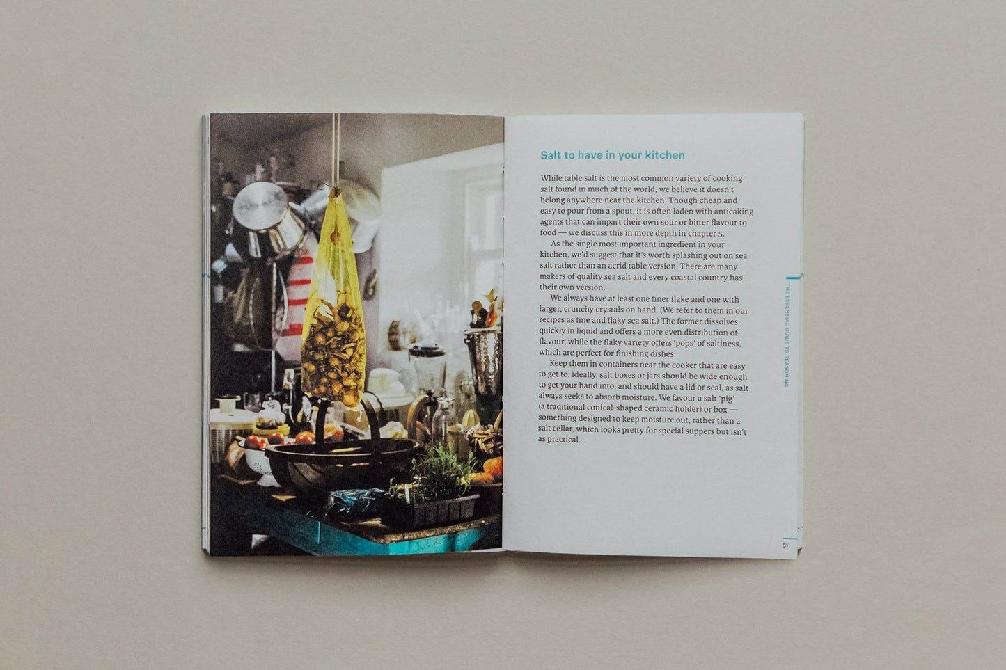 Do Sea Salt - Sea Salt Book showcasing kitchen scene with vibrant ingredients and cooking essentials.
