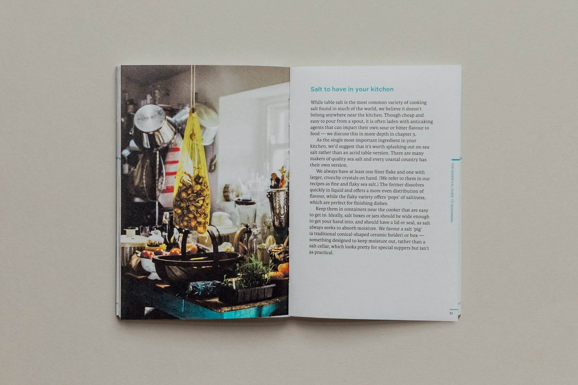 Do Sea Salt - Sea Salt Book showcasing kitchen scene with vibrant ingredients and cooking essentials.
