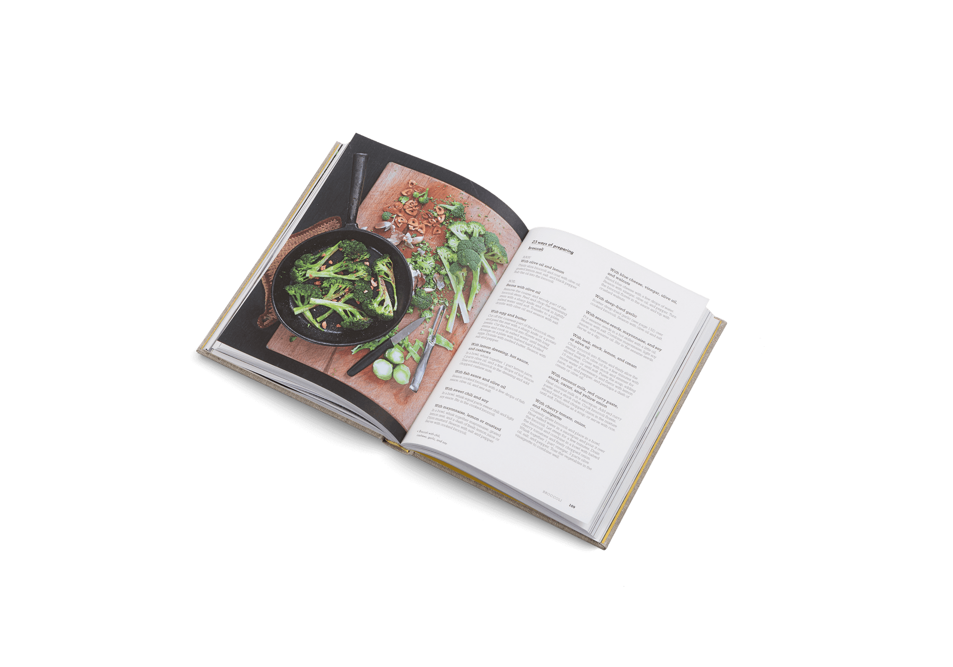 Open cookbook showing a page with a photograph of a dish and text on a white background