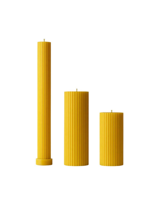 Set of 3 Cylinders made from pure beeswax, showcasing different heights and textured designs.