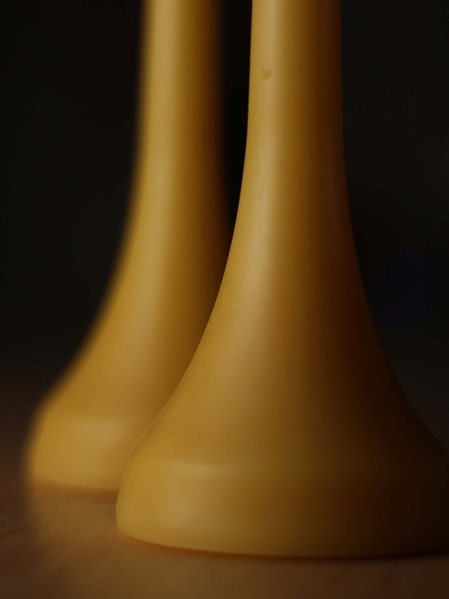 Close-up of Double Dinners beeswax dinner pillar candles, showcasing their elegant design and natural color.