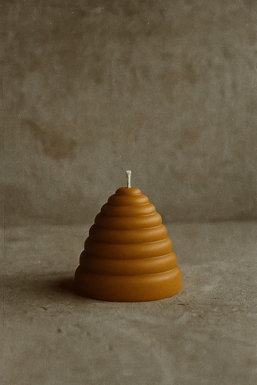 The Hive - beeswax honeycomb pillar candle, 12x12x12cm, with a self-trimming cotton wick.