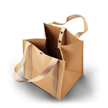 Beige tote bag with handles and a shoulder strap on a white background