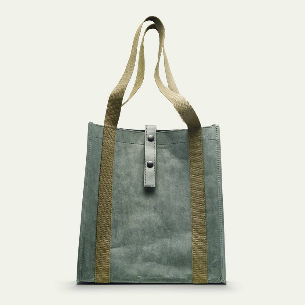 Green tote bag with brown straps on a white background