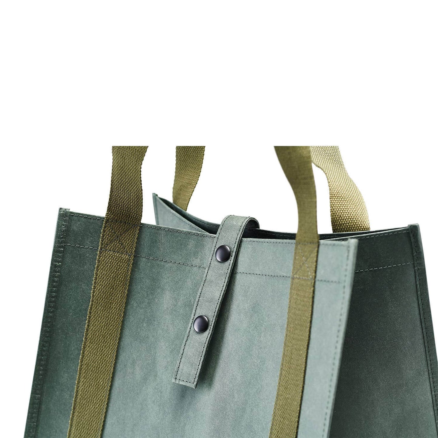 Green tote bag with brown straps on a white background