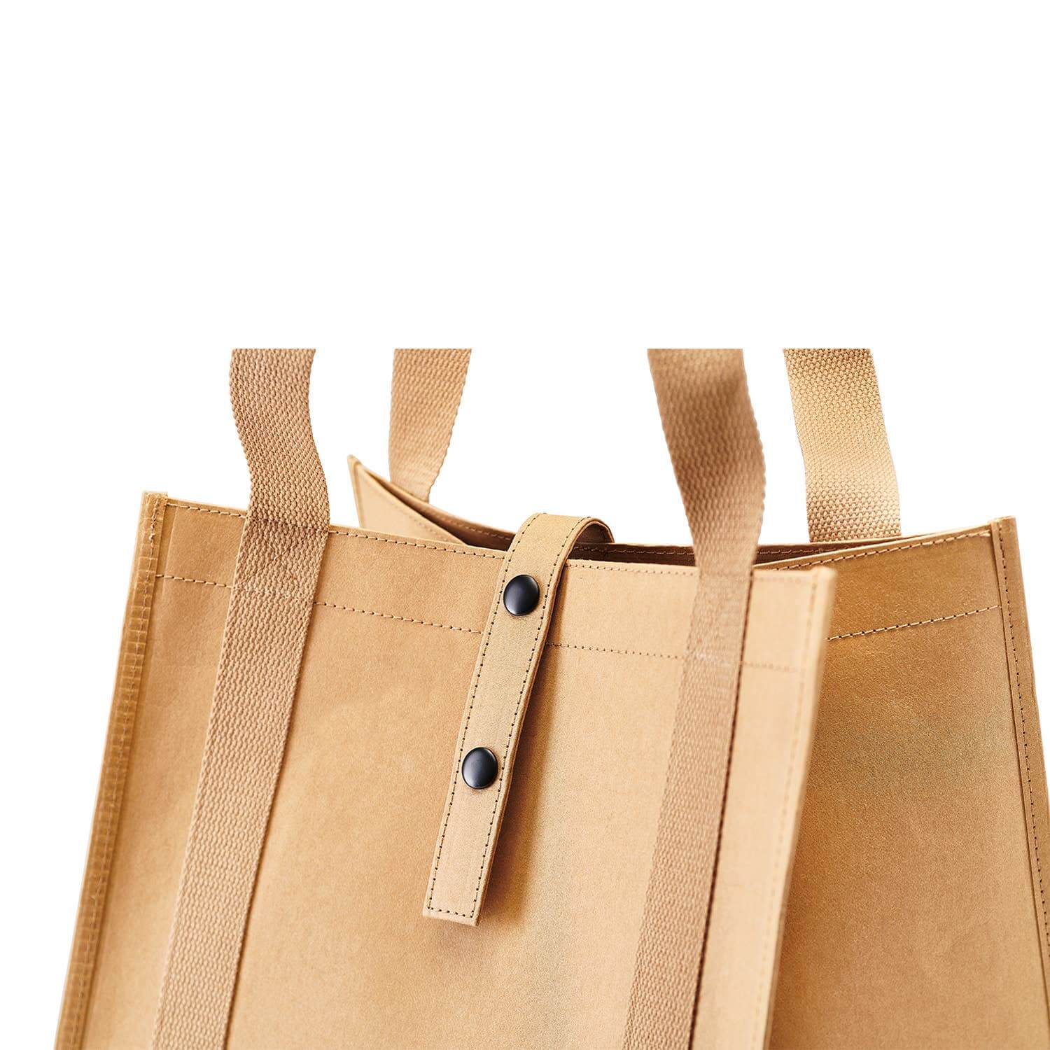 Brown tote bag with straps on a white background
