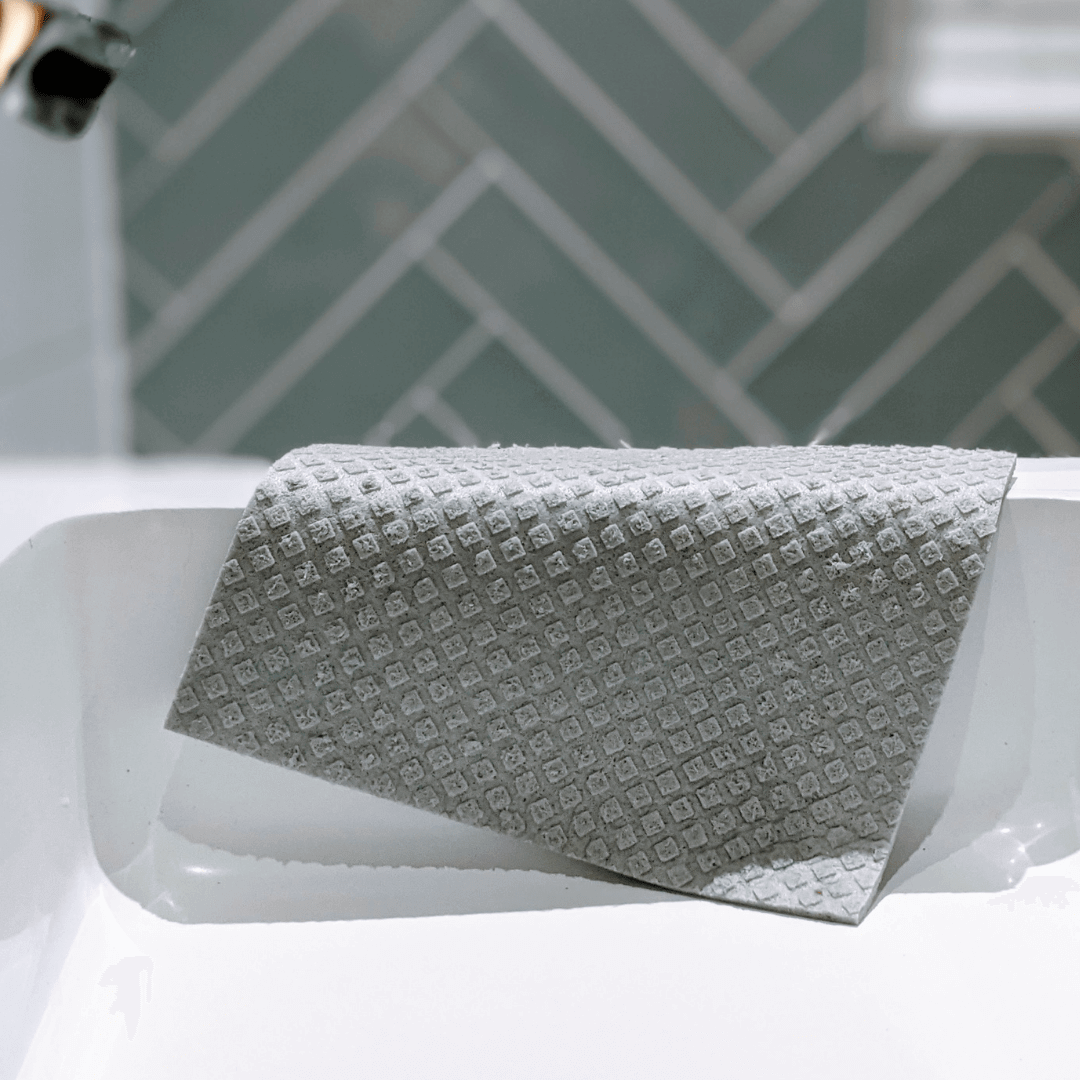 All-Purpose Eco Cloths (Swedish Dishcloths) | 6 Pack resting on a white sink, perfect for eco-friendly cleaning.