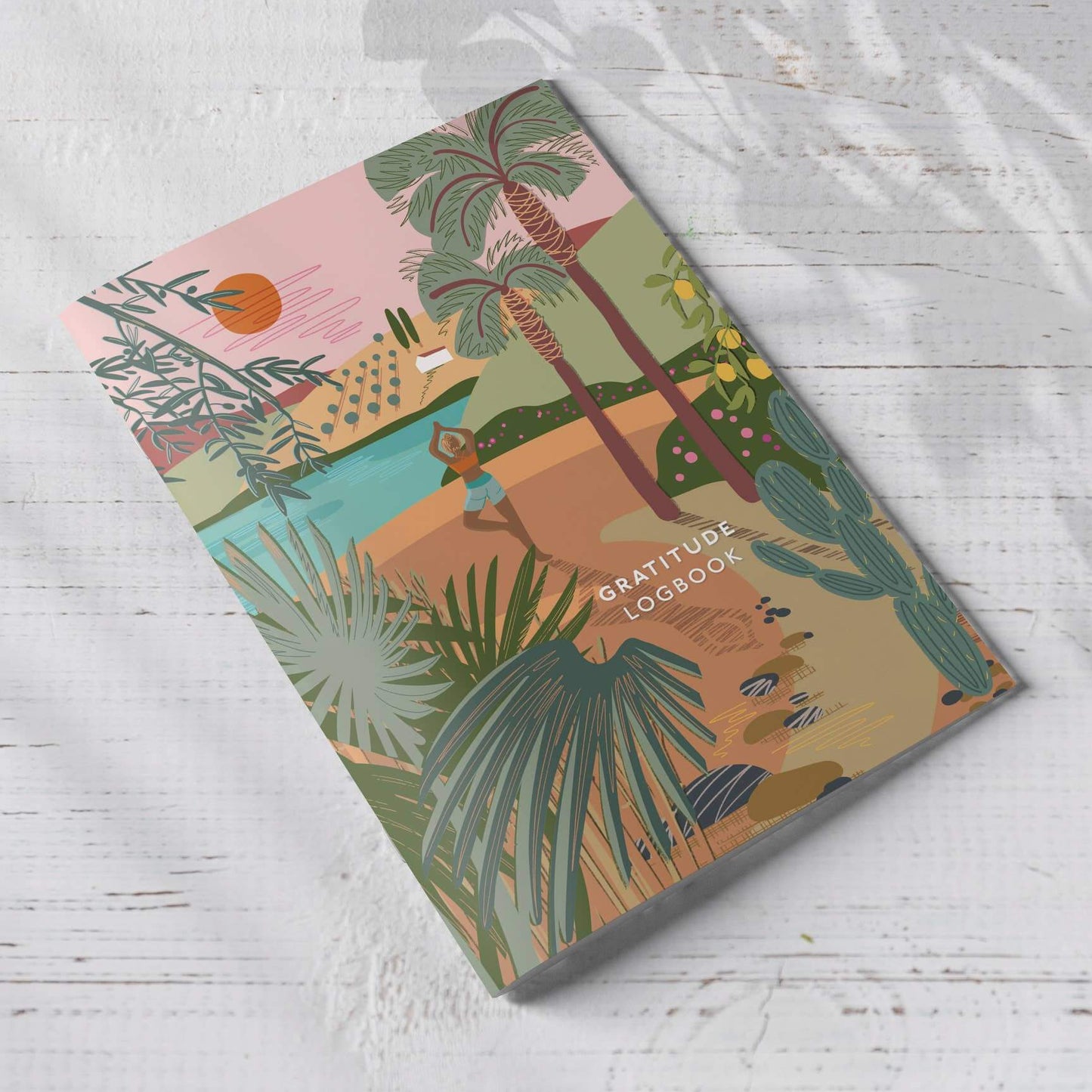 A beautifully illustrated A5 Gratitude Logbook by ONNEKE, featuring a yoga-themed cover design.