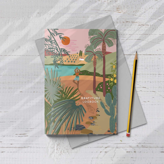 A beautifully illustrated A5 Gratitude Logbook by ONNEKE, featuring a yoga-themed cover design.