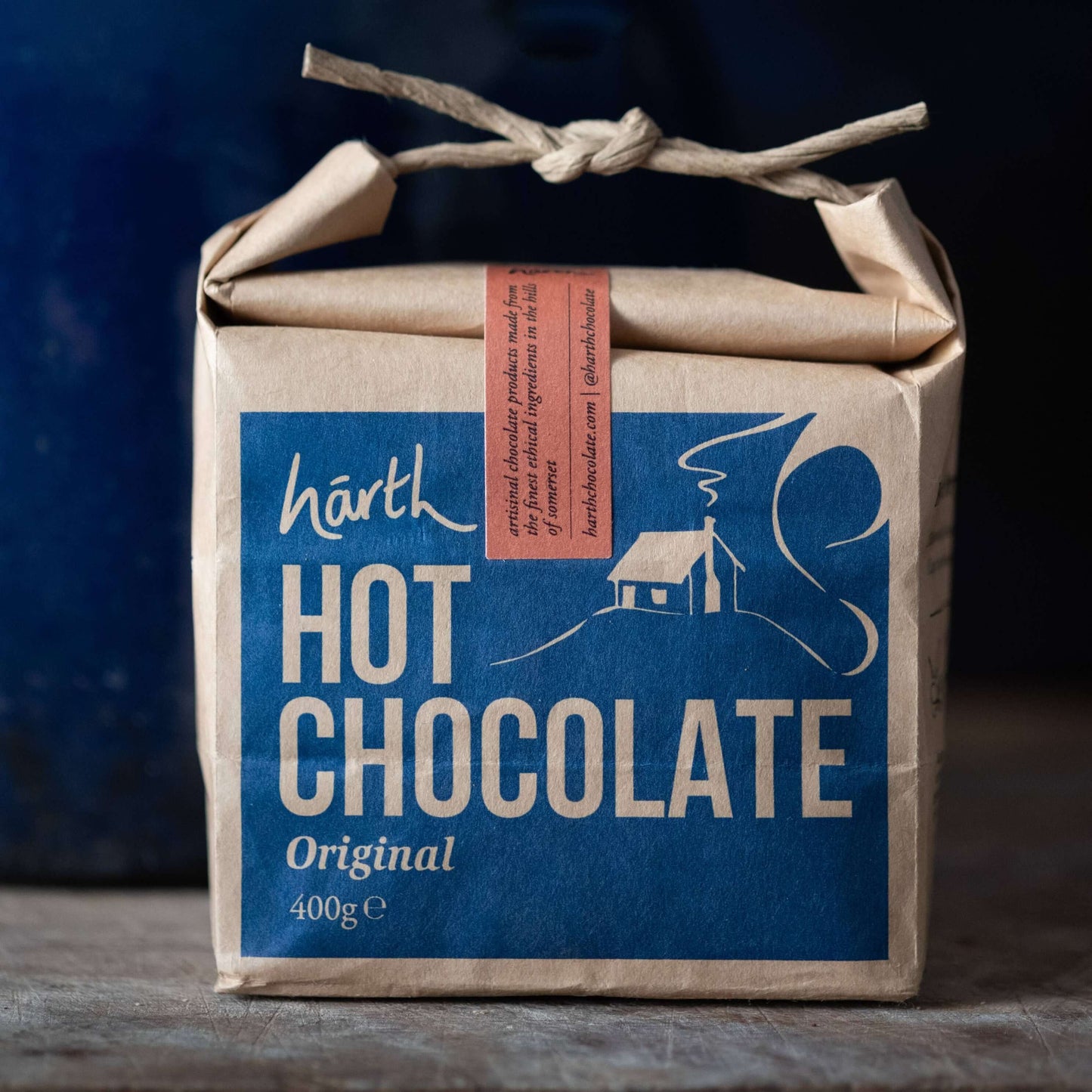 Box of Harth Hot Chocolate with a blue label and brown paper wrapping.