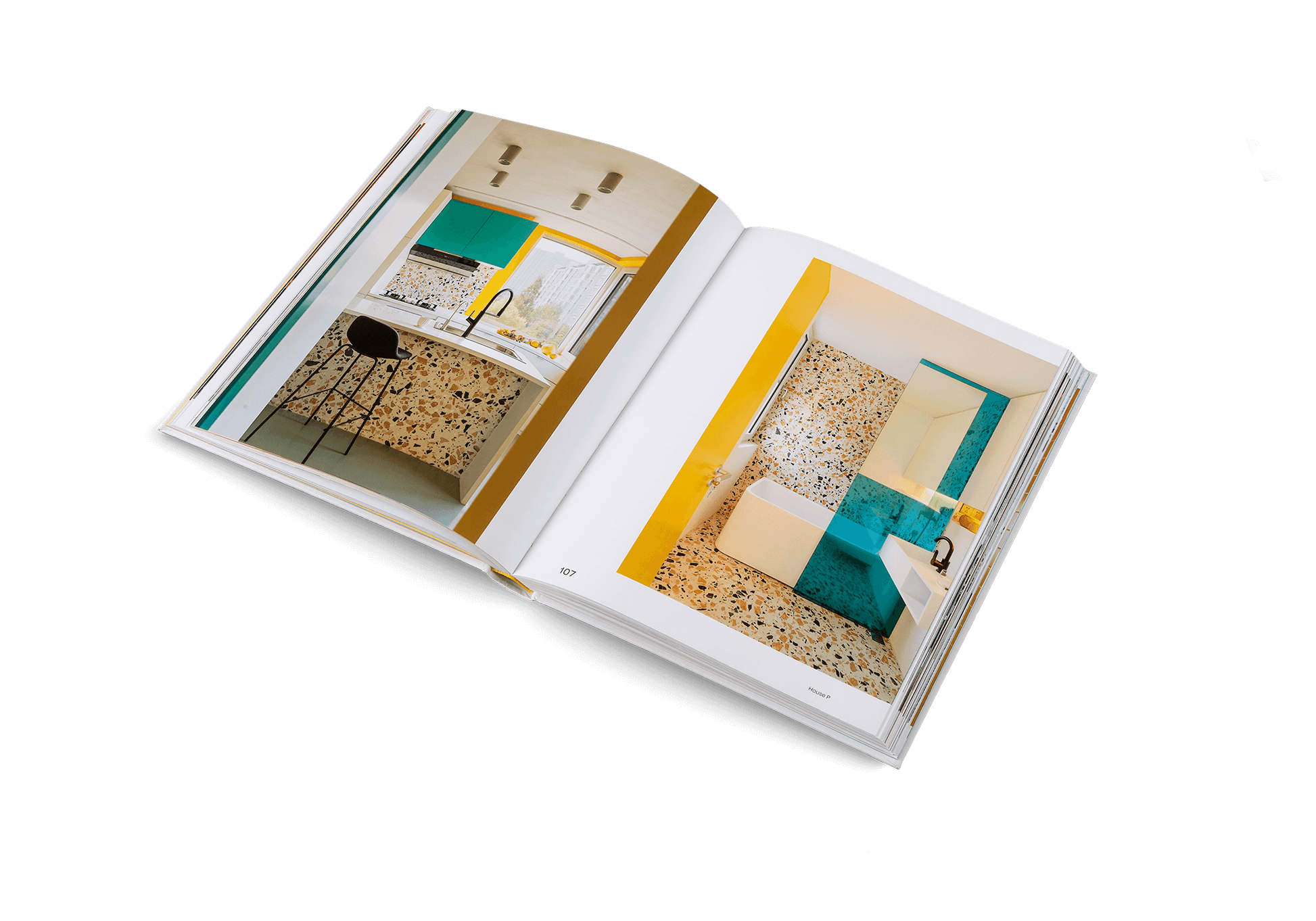 Open book showing interior design images with teal and yellow elements.