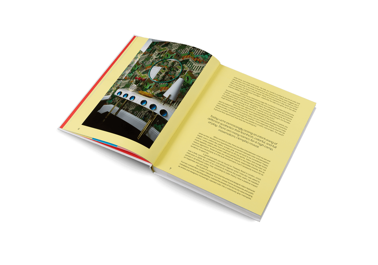 Open book showing colorful pages from House of Joy playful interior design, highlighting bold imagery and playful text.