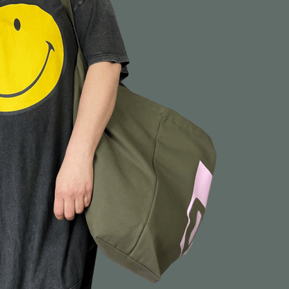 Jumbo Swim Wild Bag in olive and pink from Eco-Friendly-Online-Shop, offering a spacious, water-resistant design for sustainable open-water adventures.