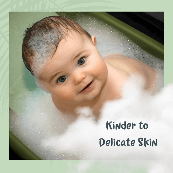 Baby in a bubble bath with text 'Kinder to Delicate Skin' on a green border