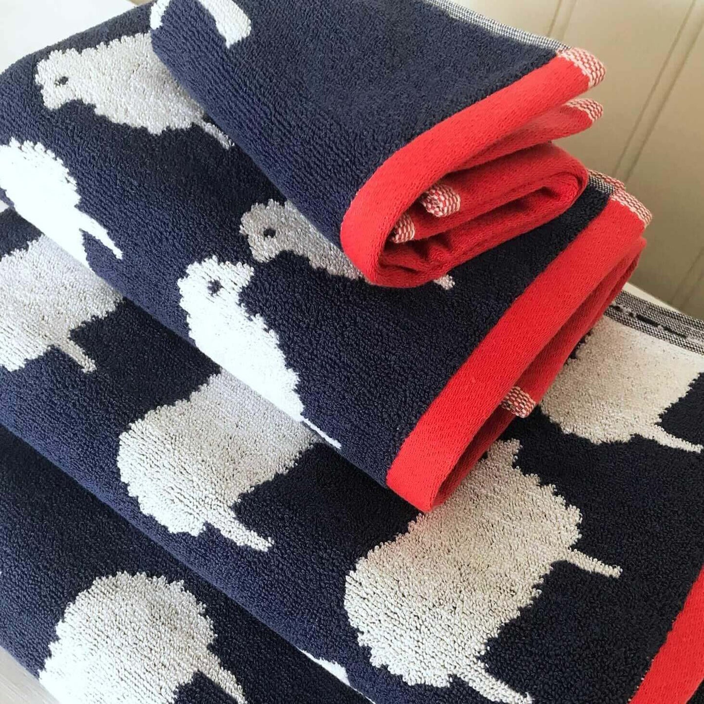 Bundle Hand Towel & Face Cloth - Kissing Sheep print stacked with red borders.