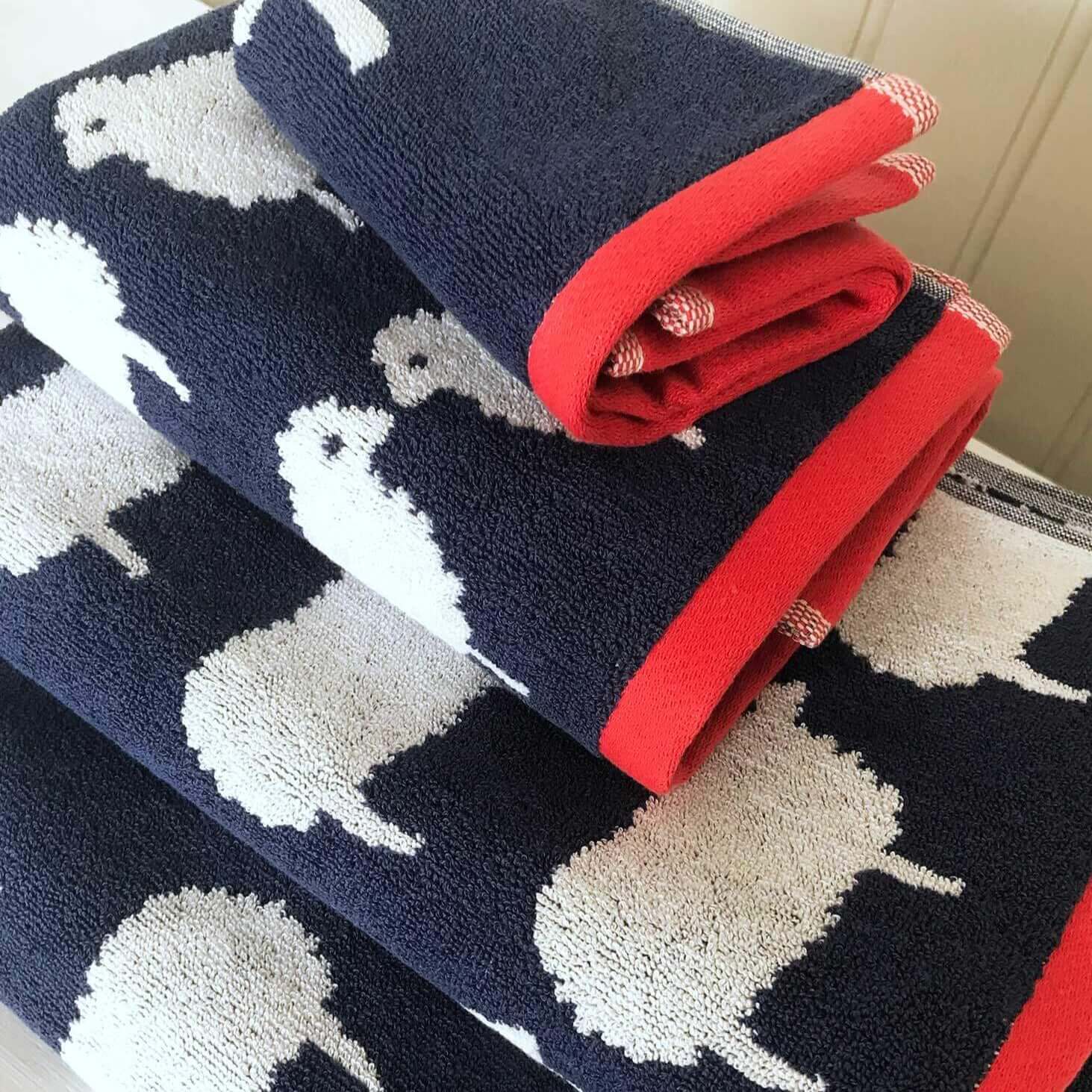 Bundle Hand Towel & Face Cloth - Kissing Sheep print stacked with red borders.