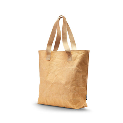 Tan HAYASHI paper leather tote bag standing upright with two flat handles