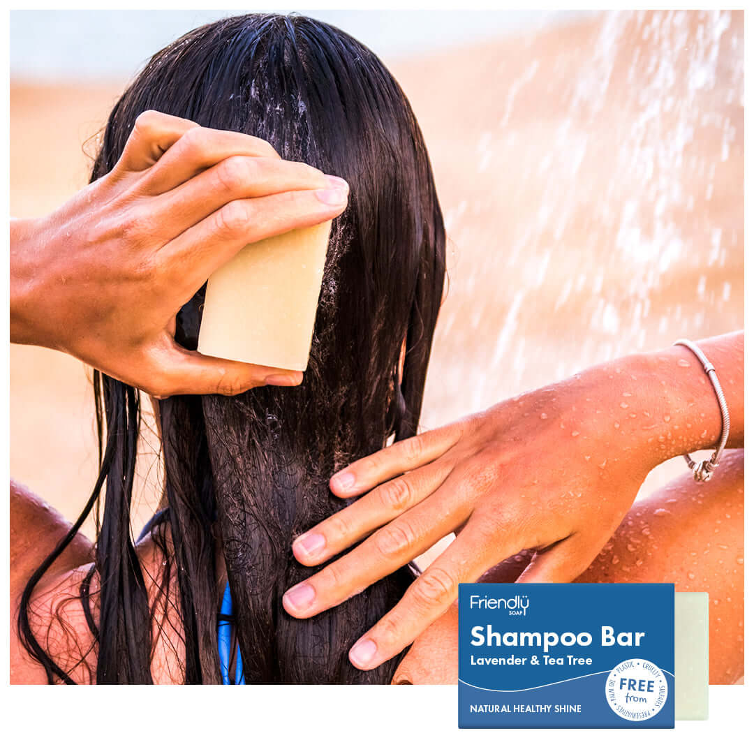 Person using a shampoo bar with water splashing, featuring Friendly Shampoo Bar branding.