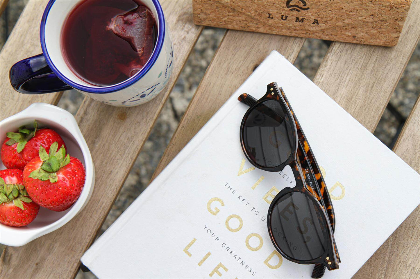 Luma Unisex Sunglasses - Fowey - Tortoise on a book with tea and strawberries, ideal for eco-friendly online shop UK.