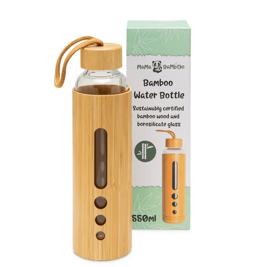 Bamboo water bottle with clear glass body and wooden cap, next to its packaging on a white background.