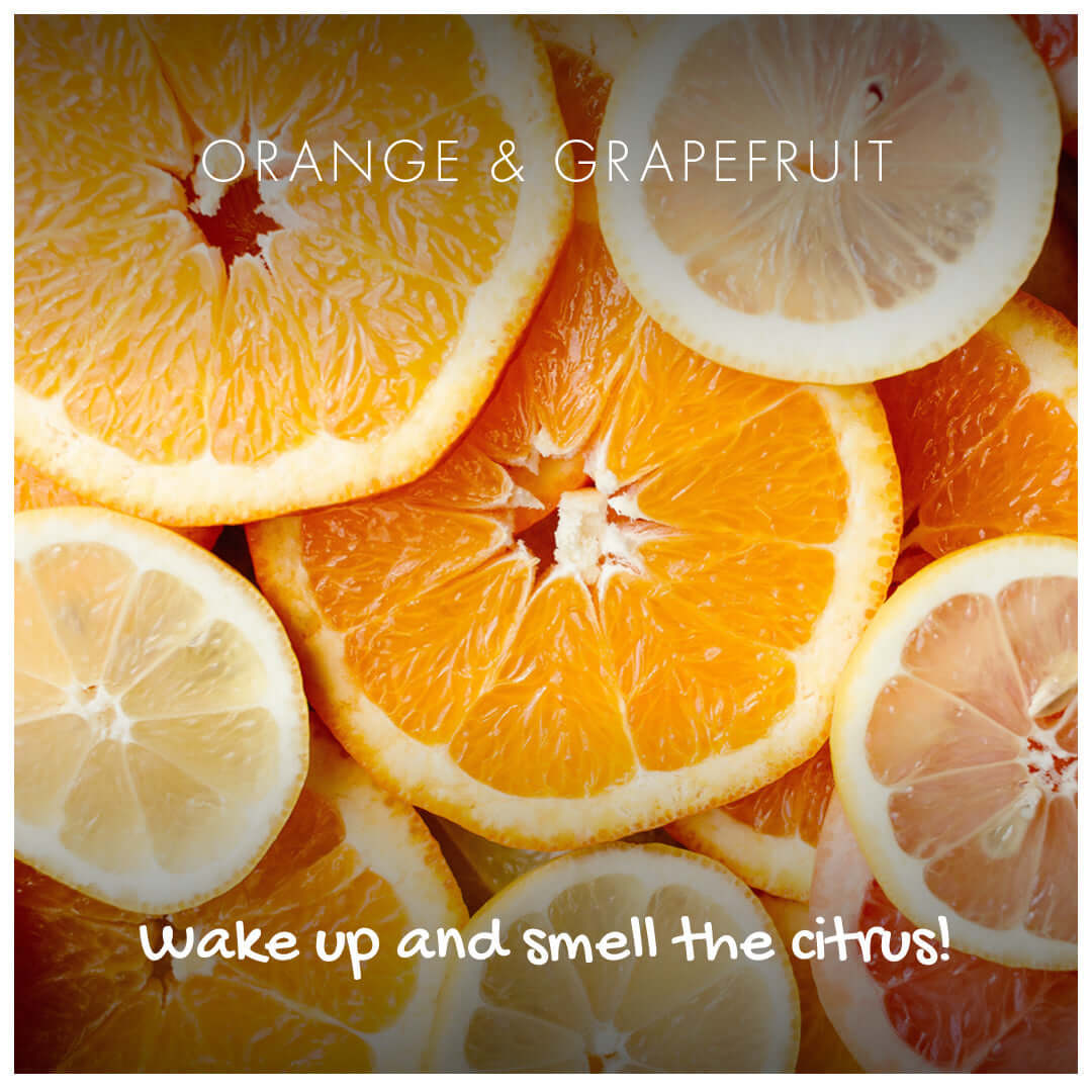 Orange & Grapefruit Natural Soap with fresh citrus slices, perfect for refreshing your skin and senses.
