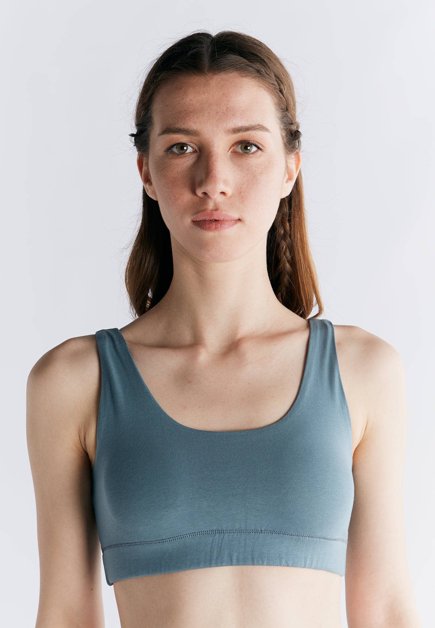 Model wearing an Organic Cotton Padded Bralette in a soft blue shade, showcasing its comfortable and supportive design.