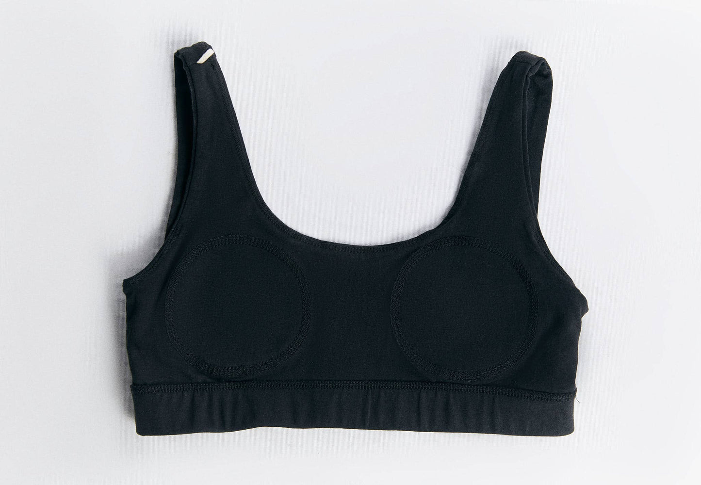 Organic Cotton Padded Bralette in black, featuring a slim silhouette and wide straps for comfort.