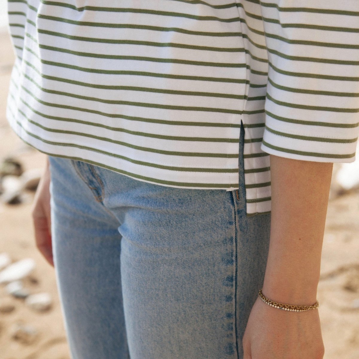 Organic Cotton Striped Boat Neck Top: Womens paired with jeans, showcasing eco-friendly fashion from alewk.club.
