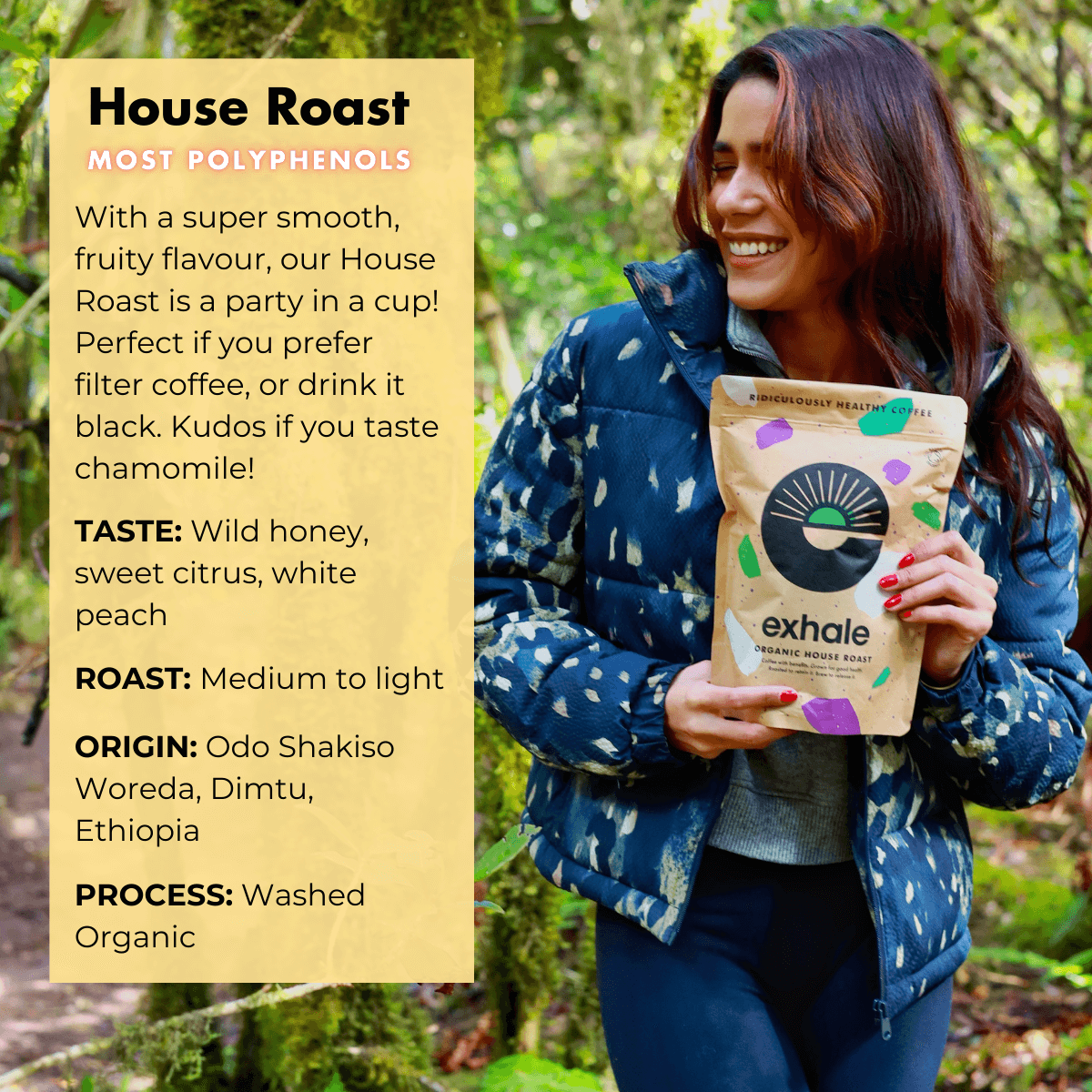 Organic House Roast Coffee package held by a smiling woman in a forest, showcasing its vibrant, eco-friendly design.