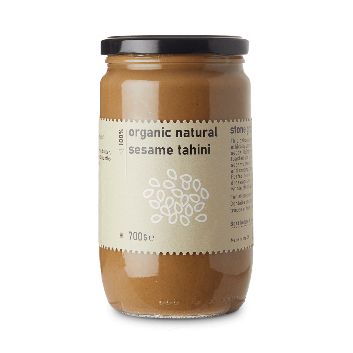 Jar of organic natural sesame tahini on a white background