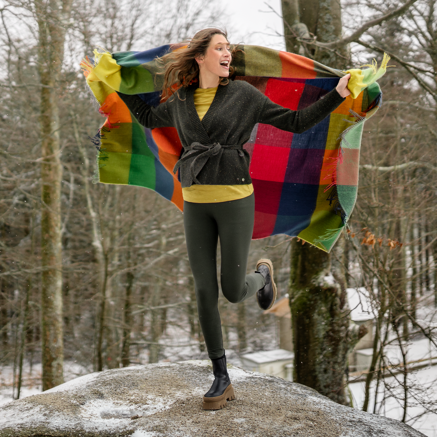 Woman wearing Organic Stretch Fleece Leggings: Womens, enjoying the outdoors with a colorful shawl.