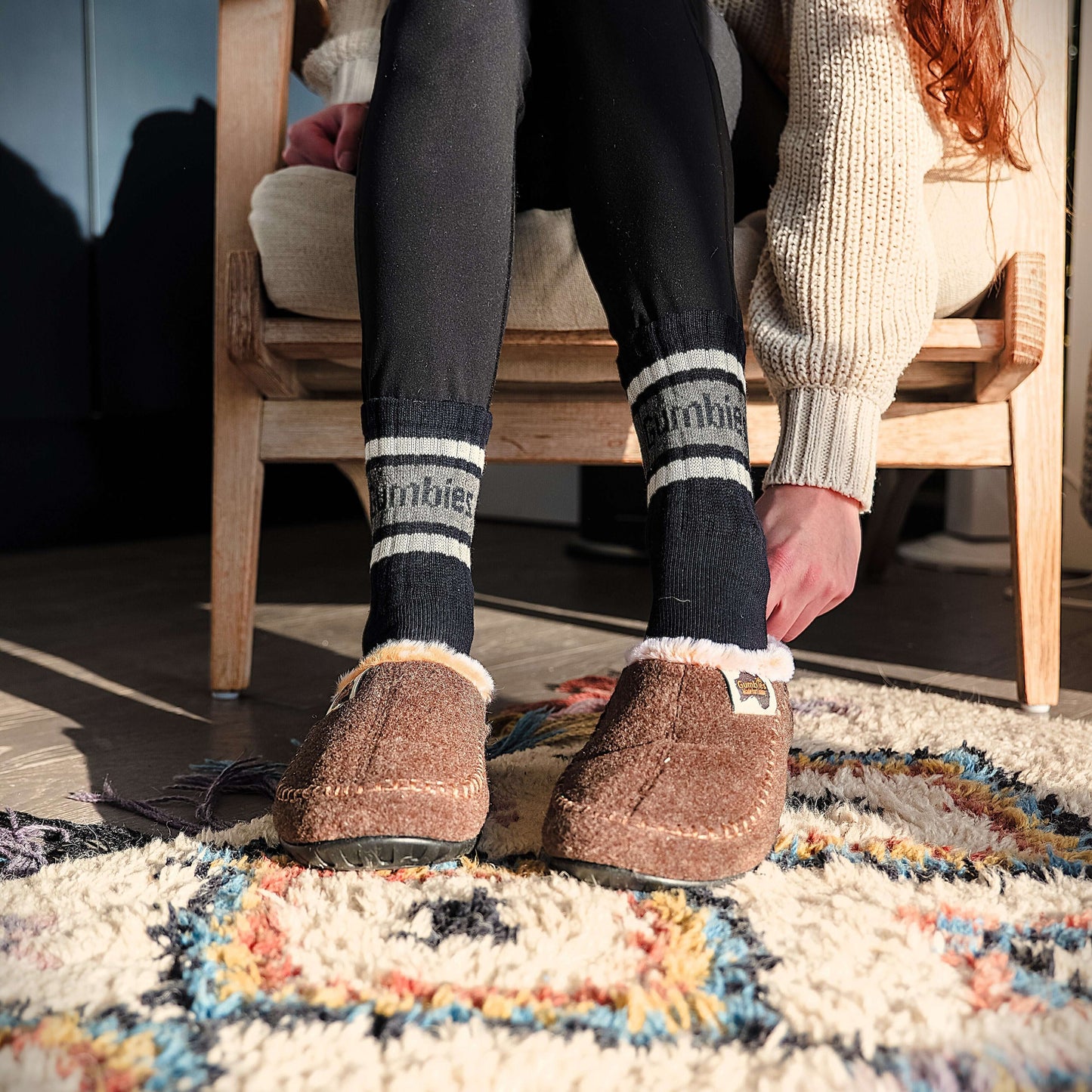 Ossa Low - Women's - Chocolate & Cream slippers worn indoors, showcasing comfort and style on a cozy rug.