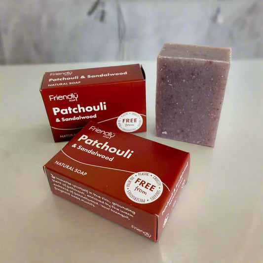 Eco Friendly Soap Bar - Patchouli & Sandalwood Glow with packaging and natural soap bar on display.