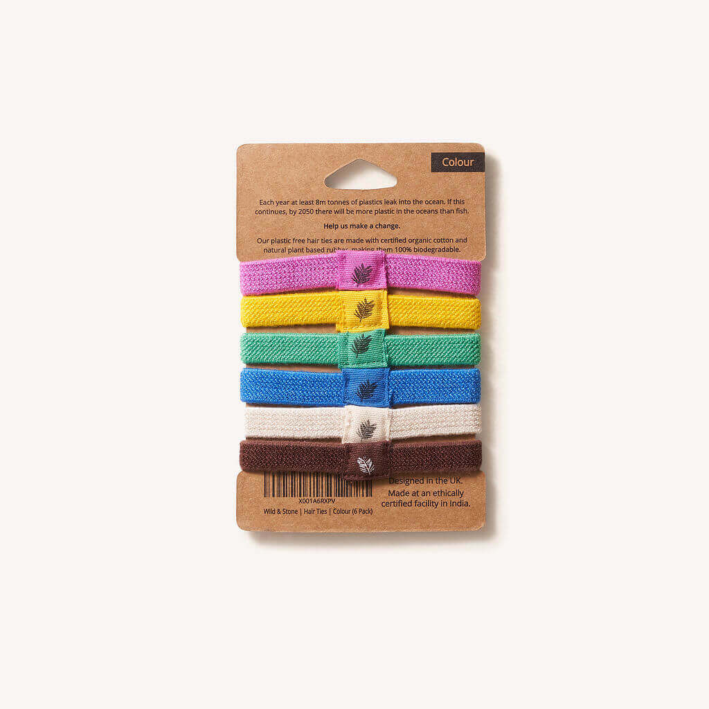 Set of colorful hairbands on a cardboard packaging with a white background