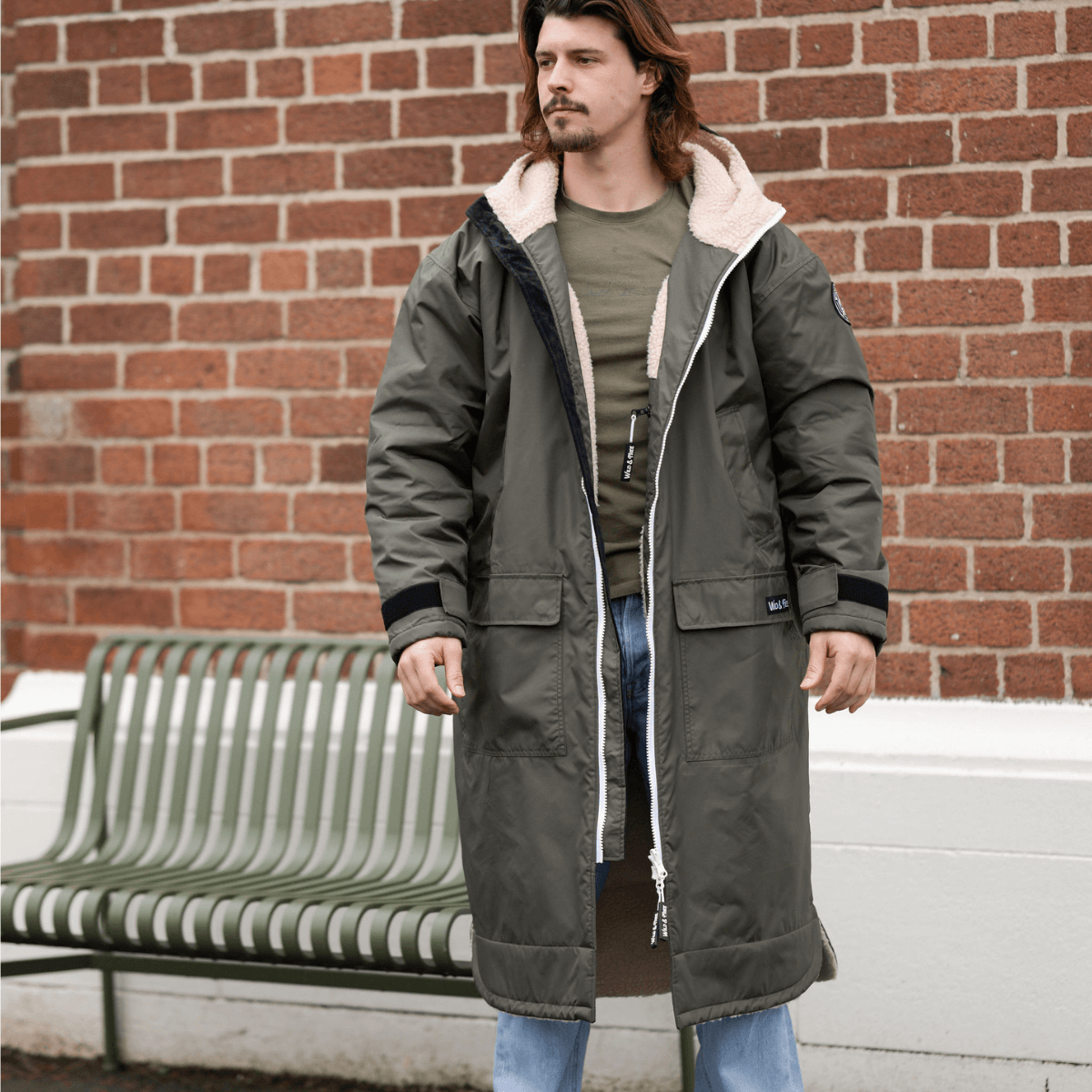 Raincoat & Changing Robe in One - The Classic Cobe Olive Green worn by a model outdoors.