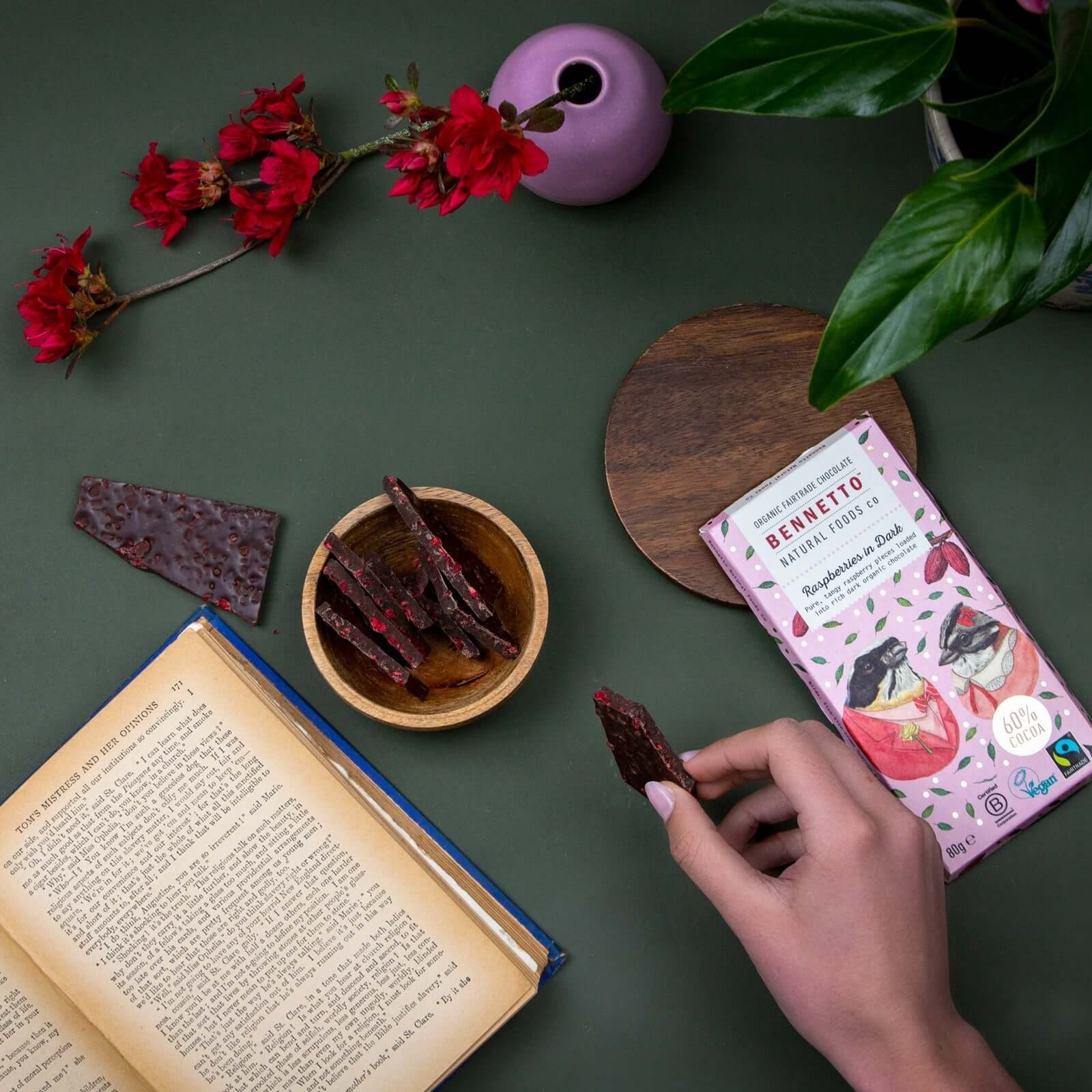Raspberries in Dark chocolate pieces with flowers and open book, eco Friendly Online Shop in Brighton and Hove