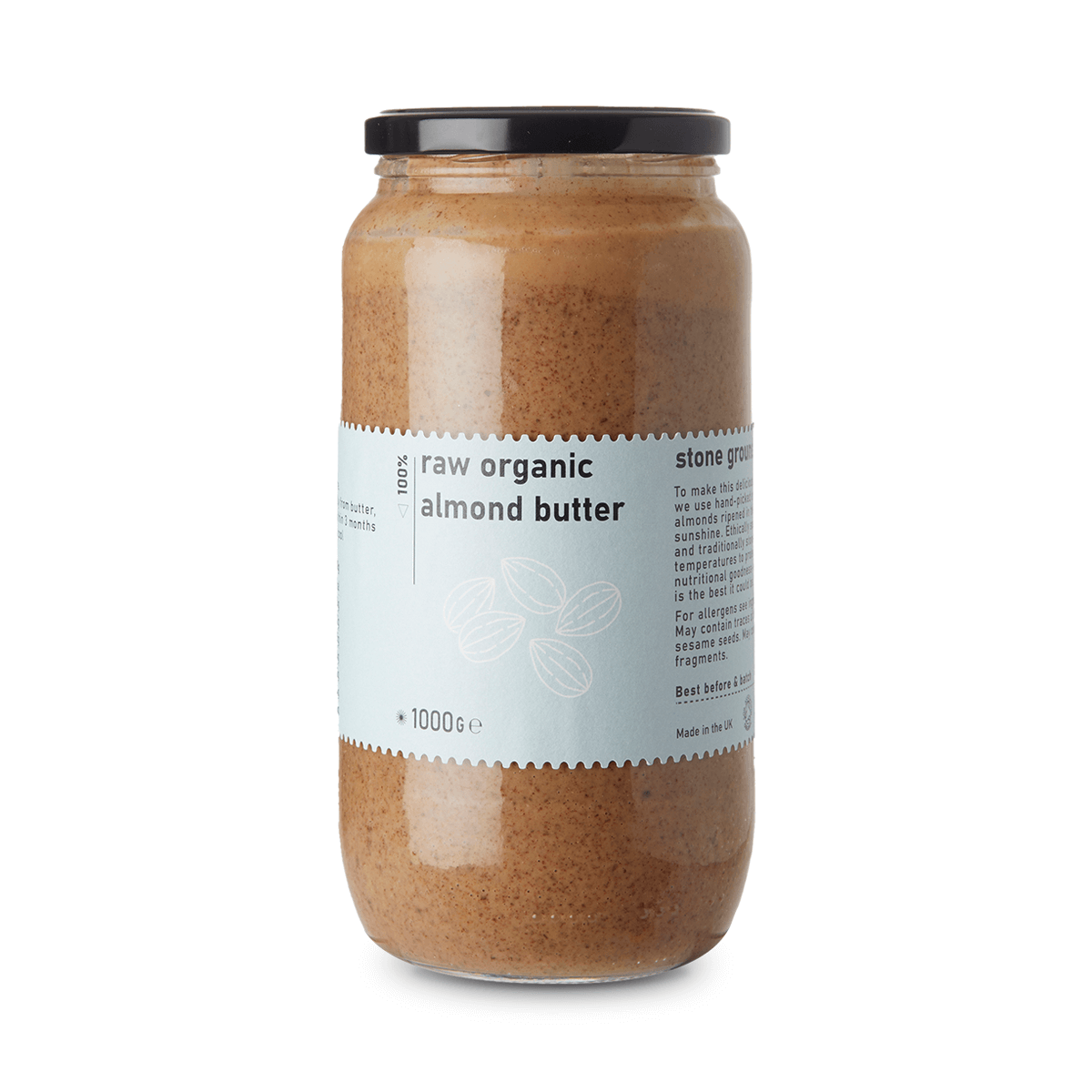 Jar of raw organic almond butter on a white background