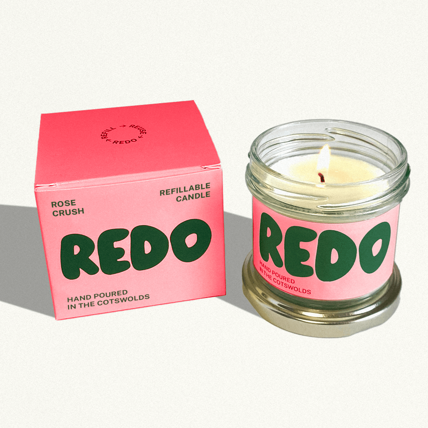 REDO candle and packaging on a white background