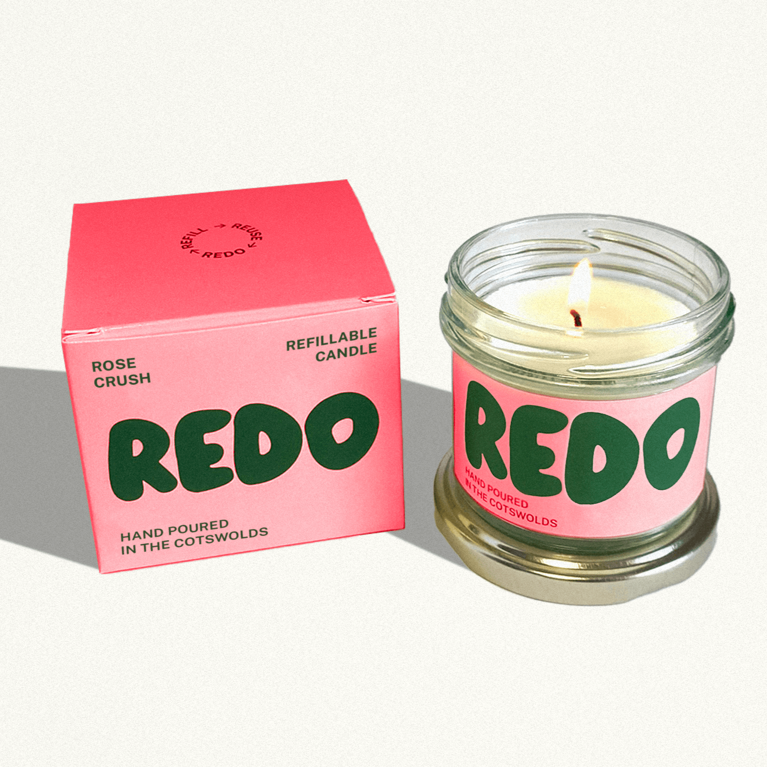 REDO candle and packaging on a white background