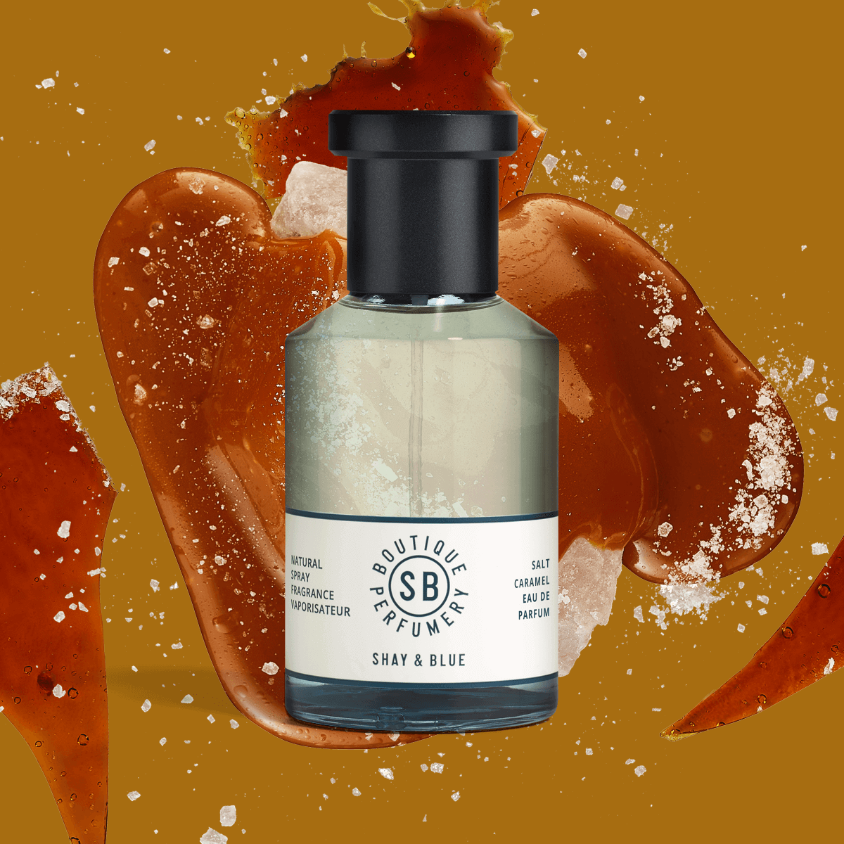 Salt Caramel Fragrance 100ml bottle displayed with glossy caramel splash background; a deeply comforting scent.