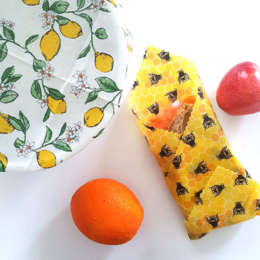 Set of 2 Large Handmade Beeswax Wraps - Lemony Bees with lemon print and honeycomb design, perfect for food storage.