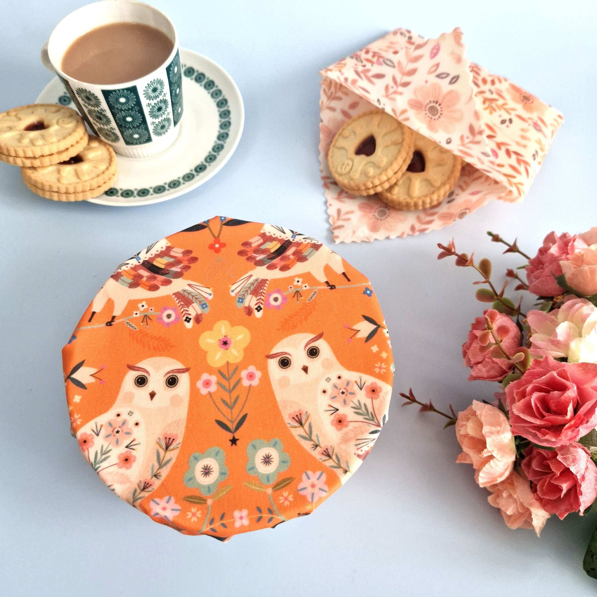Set of 3 Handmade Beeswax Wraps Owls displayed on a table with tea and cookies.