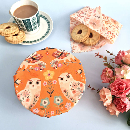 Set of 3 Handmade Beeswax Wraps Owls displayed on a table with tea and cookies.