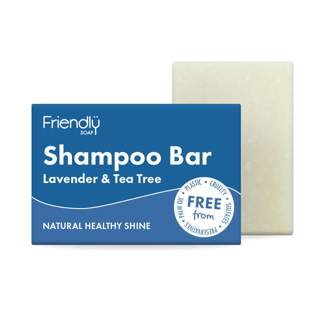 Lavender Tea Tree Shampoo Bar packaging next to the bar, promoting natural healthy shine and eco-friendly ingredients.