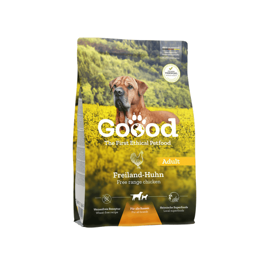 Free Range Chicken Dry Food for adult dogs in a bag with a dog and nature background.