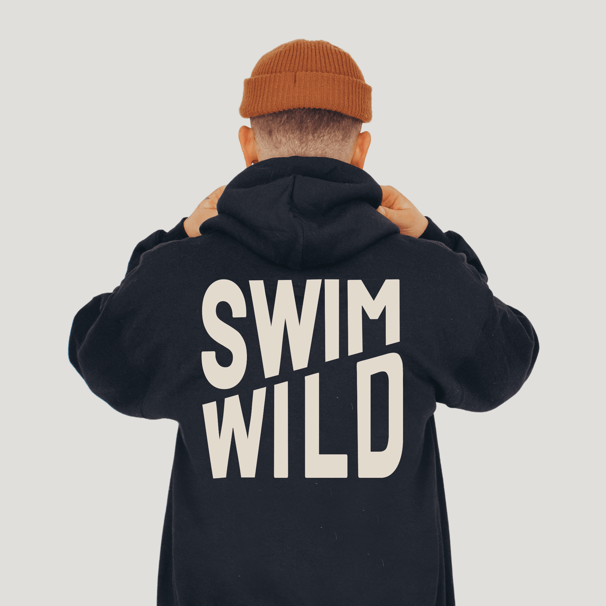 Swim Wild black hoody from Eco-Friendly-Online-Shop, offering a cosy, eco-conscious layer for open-water enthusiasts.
