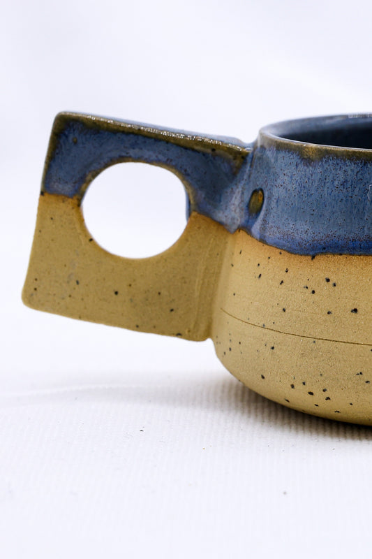 TerraBlu Formo Handmade Ceramic Stoneware Coffee Mug with unique handle design and earthy tones for eco-friendly elegance.