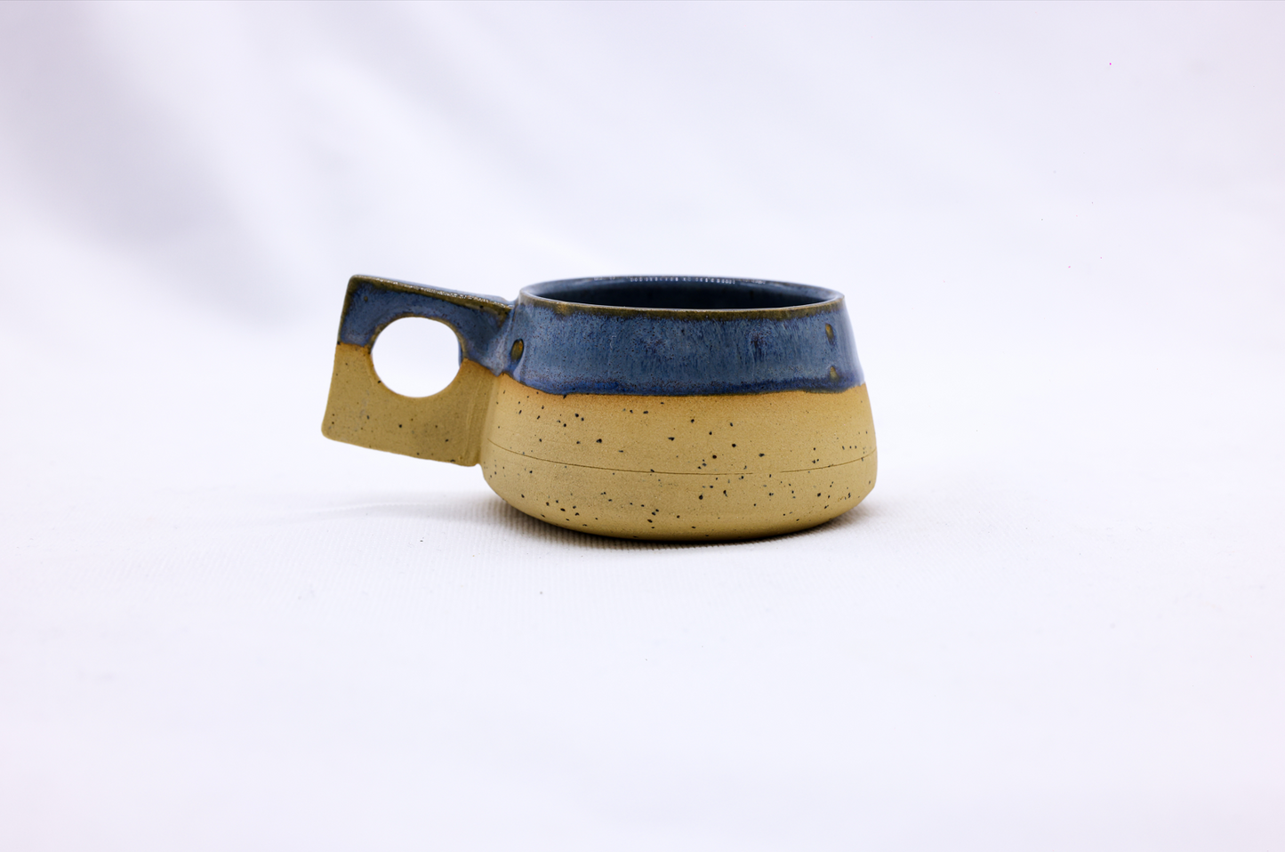 TerraBlu Formo Handmade Ceramic Stoneware Coffee Mug showcasing unique design and earthy colors.
